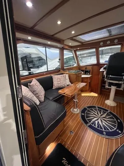 Persistence Yacht Photos Pics 2011 Sabre 40 Sedan interior with elegant wood finish and comfortable seating.