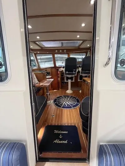 Persistence Yacht Photos Pics Interior of 2011 Sabre 40 Sedan yacht with elegant wood finish and nautical decor.