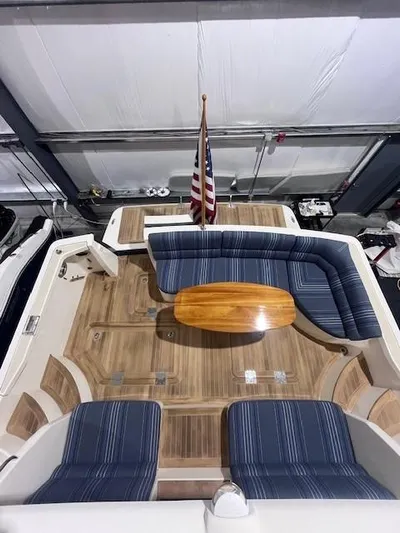 Persistence Yacht Photos Pics 2011 Sabre 40 Sedan yacht interior with wooden deck and blue-striped seating.