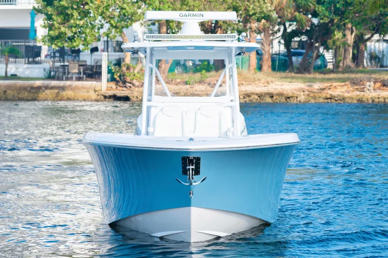 Freedom Frigate Yacht Photos Pics 2025 Invincible 36 Open Fisherman boat on water, front view.