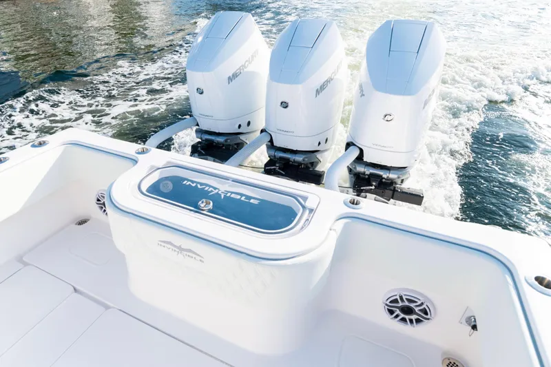 Freedom Frigate Yacht Photos Pics 2025 Invincible 36 Open Fisherman boat with triple Mercury engines on water.