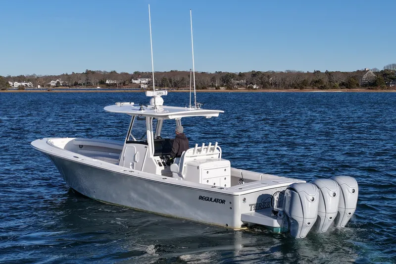 Three Ladies Yacht Photos Pics 2021 Regulator 34 boat with triple engines on calm water.