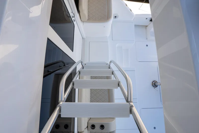 Galati Yacht Sales Trade Yacht Photos Pics Staircase on 2021 Viking 72 Enclosed Bridge yacht, featuring sleek design and modern materials.