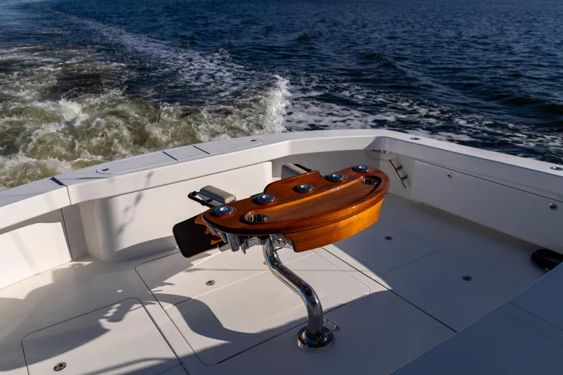 Galati Yacht Sales Trade Yacht Photos Pics 2021 Viking 72 Enclosed Bridge yacht deck with wooden fishing rod holder.