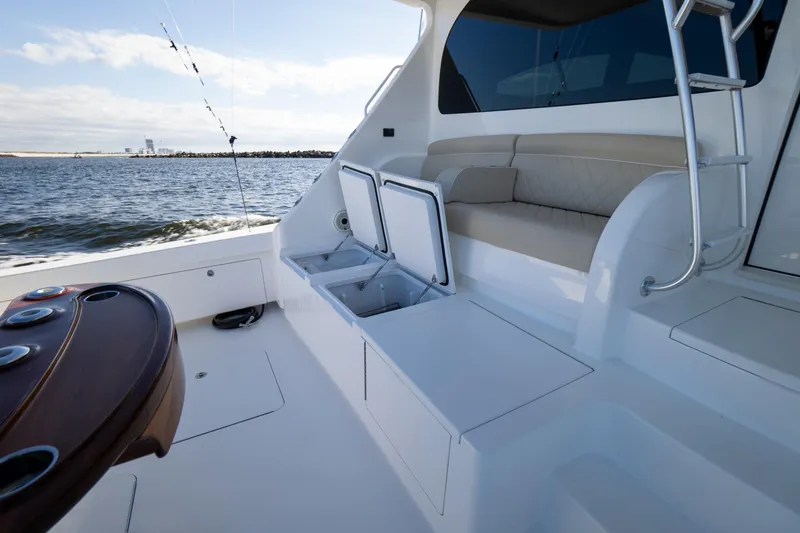 Galati Yacht Sales Trade Yacht Photos Pics 2021 Viking 72 Enclosed Bridge yacht deck with seating and storage, ocean view.