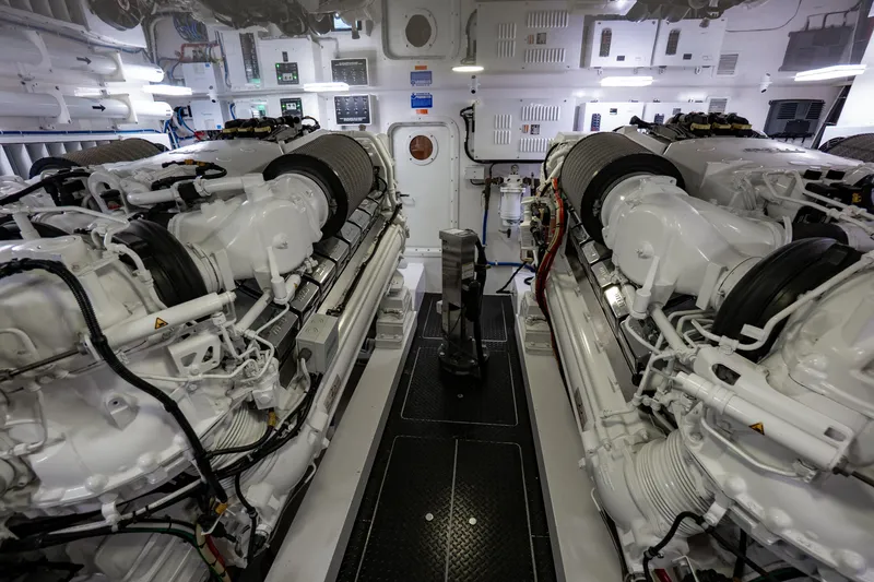 Galati Yacht Sales Trade Yacht Photos Pics Engine room of 2021 Viking 72 Enclosed Bridge yacht, featuring dual powerful engines.