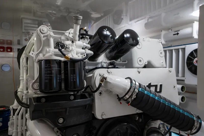 Galati Yacht Sales Trade Yacht Photos Pics Engine room of 2021 Viking 72 Enclosed Bridge yacht, showcasing detailed machinery components.