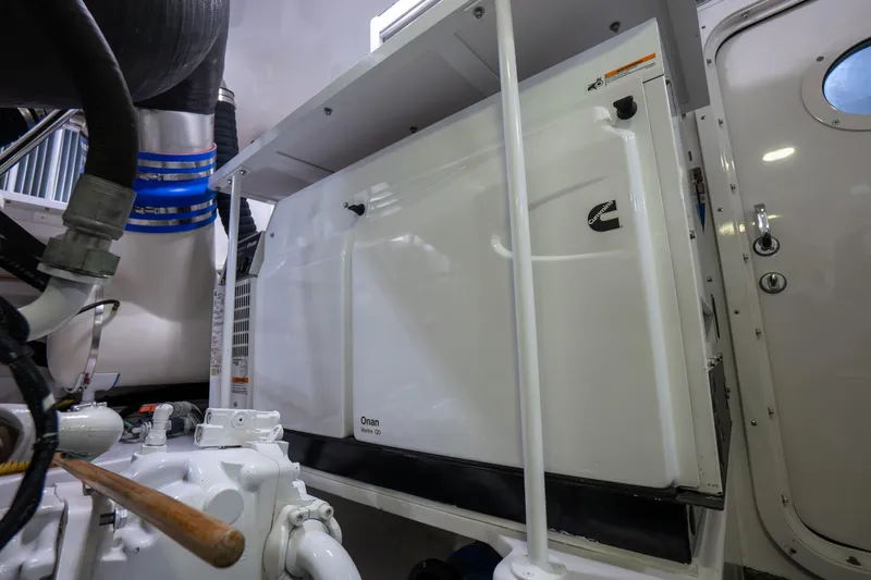 Galati Yacht Sales Trade Yacht Photos Pics Engine room of 2021 Viking 72 Enclosed Bridge yacht with Cummins Onan generator.