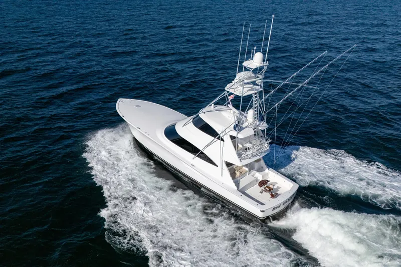 Galati Yacht Sales Trade Yacht Photos Pics 2021 Viking 72 Enclosed Bridge yacht cruising on open ocean waters.