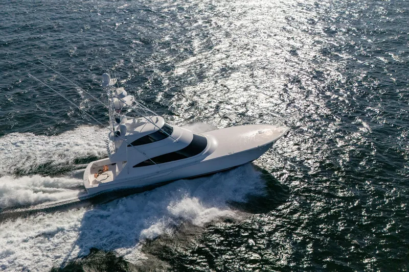 Galati Yacht Sales Trade Yacht Photos Pics 2021 Viking 72 Enclosed Bridge yacht cruising on open water.