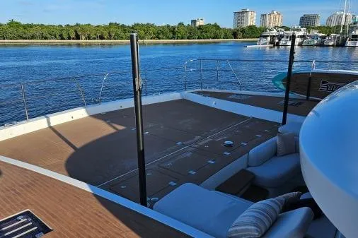 Sunlove Yacht Photos Pics 2024 Lagoon SIXTY 7 yacht deck with waterfront view and modern seating.