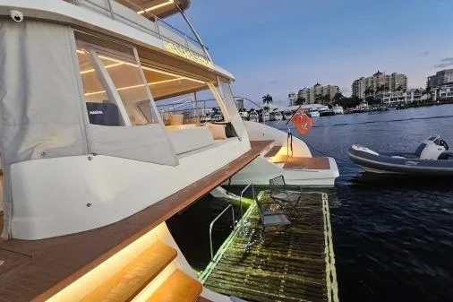 Sunlove Yacht Photos Pics 2024 Lagoon SIXTY 7 yacht docked at sunset, featuring elegant design and modern amenities.