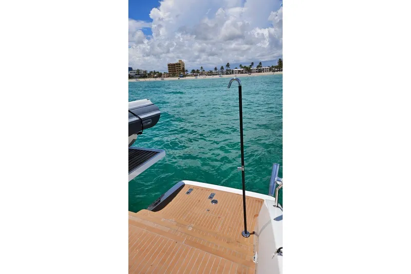 Sunlove Yacht Photos Pics 2024 Lagoon SIXTY 7 yacht deck with ocean view and distant shoreline.