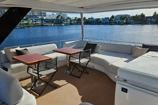 Sunlove Yacht Photos Pics Luxurious 2024 Lagoon SIXTY 7 yacht deck with seating and waterfront view.