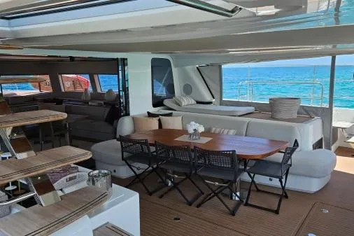 Sunlove Yacht Photos Pics Luxurious interior of 2024 Lagoon SIXTY 7 yacht with elegant seating and ocean view.