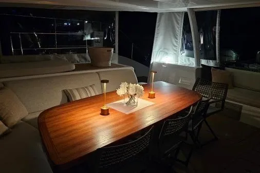 Sunlove Yacht Photos Pics Luxurious interior of 2024 Lagoon SIXTY 7 yacht with elegant dining area.