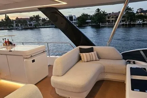 Sunlove Yacht Photos Pics 2024 Lagoon SIXTY 7 yacht with elegant seating and waterfront view.