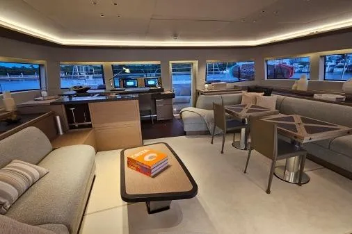 Sunlove Yacht Photos Pics Luxurious interior of 2024 Lagoon SIXTY 7 yacht with modern furnishings and panoramic windows.