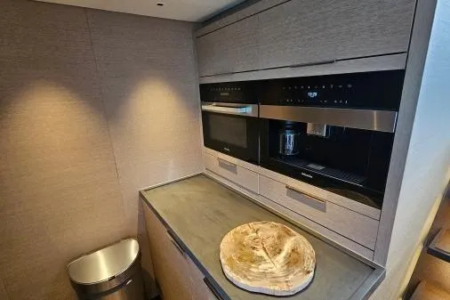 Sunlove Yacht Photos Pics Modern kitchen area in 2024 Lagoon SIXTY 7 yacht with sleek appliances and minimalist design.