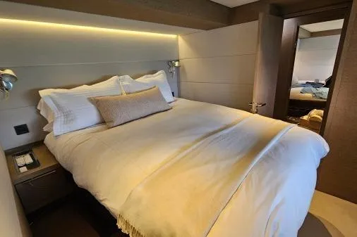 Sunlove Yacht Photos Pics Luxurious bedroom interior of 2024 Lagoon SIXTY 7 yacht with modern design.