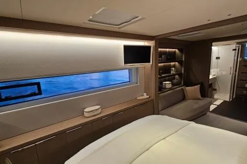 Sunlove Yacht Photos Pics Luxurious interior of 2024 Lagoon SIXTY 7 yacht with modern furnishings and ocean view.