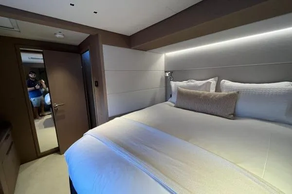Sunlove Yacht Photos Pics Luxurious bedroom interior of 2024 Lagoon SIXTY 7 yacht with modern design.