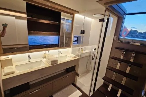 Sunlove Yacht Photos Pics Luxurious bathroom in 2024 Lagoon SIXTY 7 yacht with dual sinks and ocean view.