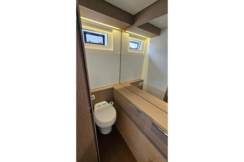 Sunlove Yacht Photos Pics Modern bathroom interior of 2024 Lagoon SIXTY 7 yacht with sleek design and compact layout.