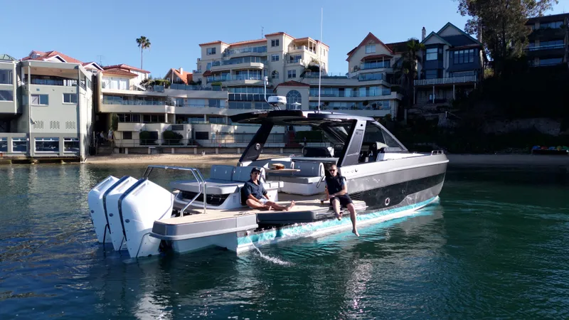  Yacht Photos Pics Luxury Schaefer V44 2024 yacht near modern coastal homes.