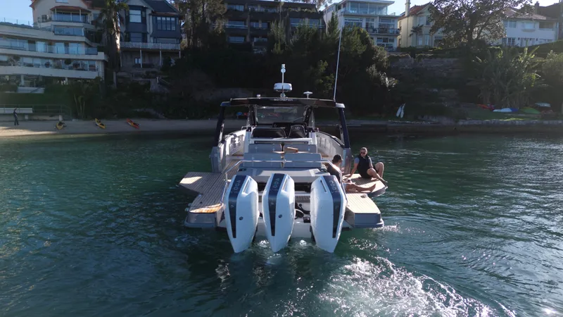 Yacht Photos Pics Schaefer V44 2024 yacht on water near coastal homes.
