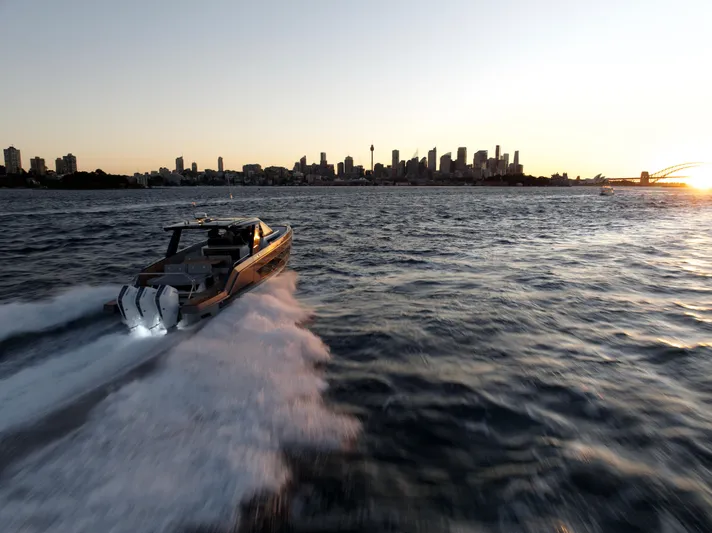  Yacht Photos Pics Schaefer V44 Yacht 2024 cruising at sunset with city skyline.