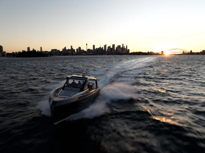  Yacht Photos Pics Schaefer V44 yacht 2024 cruising at sunset with city skyline.