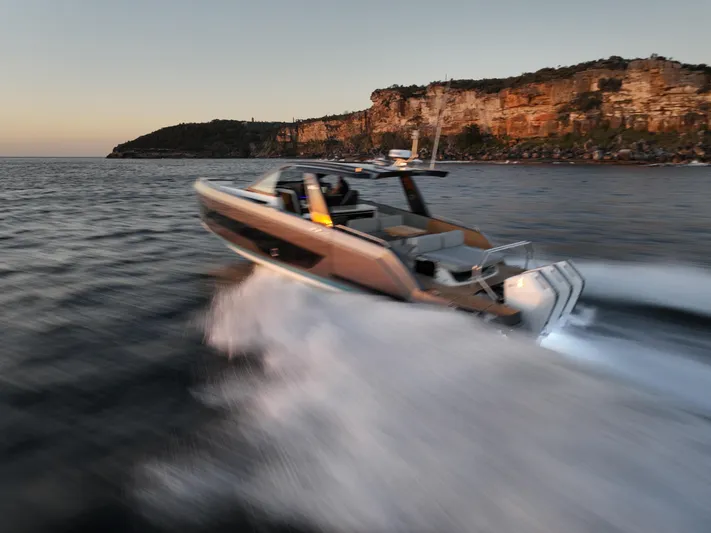  Yacht Photos Pics Schaefer V44 2024 yacht speeding along rocky coastline.