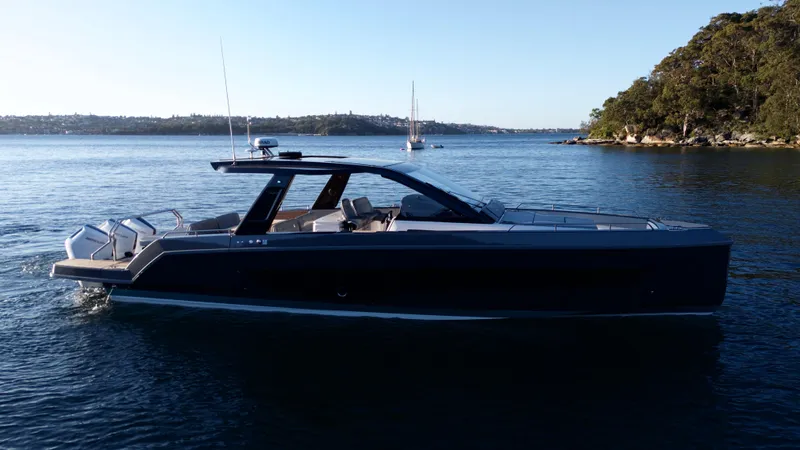  Yacht Photos Pics 2024 Schaefer V44 yacht on calm waters at sunset.