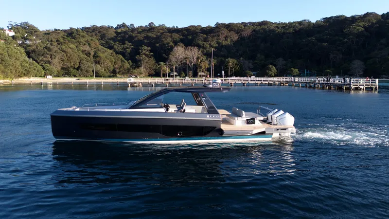  Yacht Photos Pics 2024 Schaefer V44 yacht on calm water near a pier.
