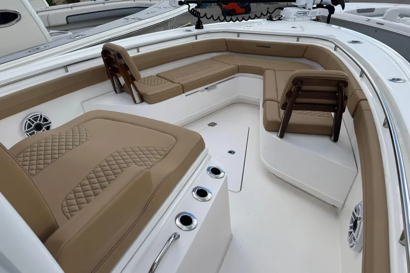  Yacht Photos Pics 2025 Caymas 291 boat interior with tan cushioned seating and modern design.