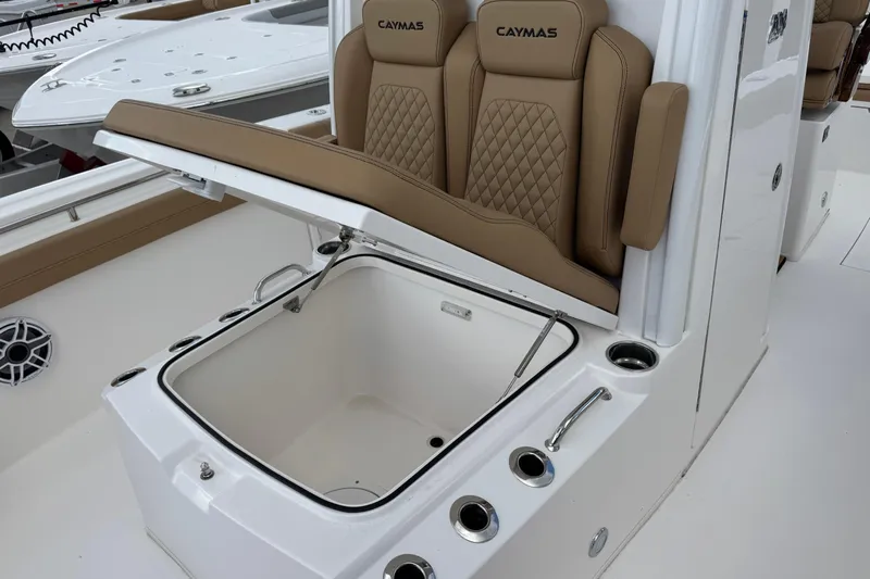  Yacht Photos Pics 2025 Caymas 291 boat interior with open storage compartment and cushioned seating.