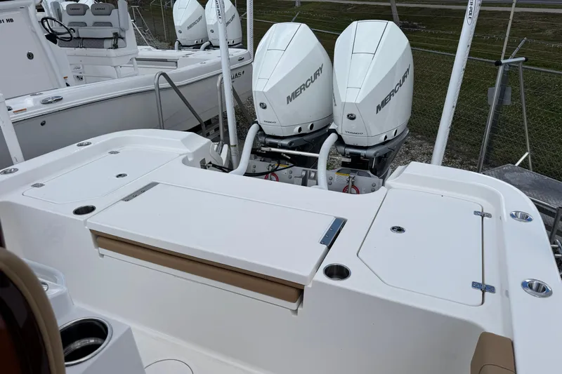  Yacht Photos Pics 2025 Caymas 291 boat with dual Mercury outboard engines, featuring a spacious deck layout.
