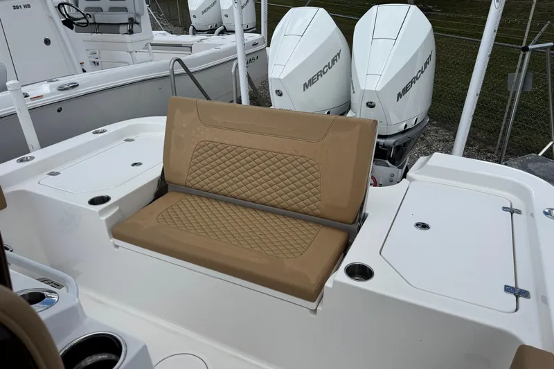  Yacht Photos Pics 2025 Caymas 291 boat with tan seating and dual Mercury outboard engines.