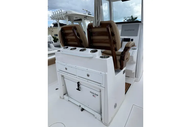  Yacht Photos Pics 2025 Caymas 291 boat interior with dual seats and Garmin navigation system.