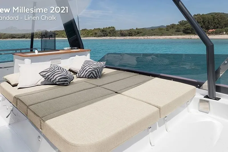  Yacht Photos Pics Luxury Fountaine Pajot MY6 2025 yacht with sunbed, ocean view, and stylish cushions.