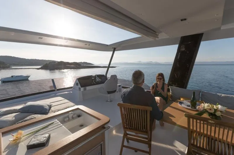  Yacht Photos Pics Luxury 2025 Fountaine Pajot MY6 yacht interior with ocean view and dining setup.