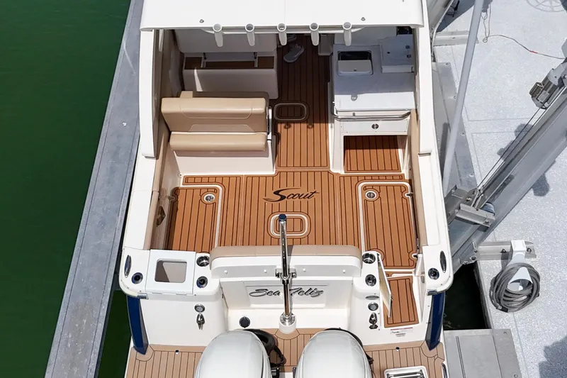  Yacht Photos Pics 2022 Scout 277 Dorado boat with teak deck and seating, docked at marina.