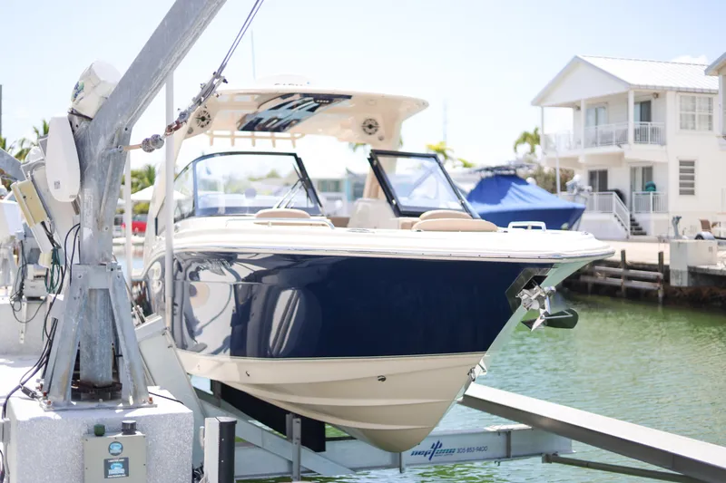  Yacht Photos Pics 2022 Scout 277 Dorado boat docked at a marina, sunny day.