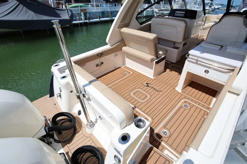  Yacht Photos Pics 2022 Scout 277 Dorado boat interior with teak flooring and seating.