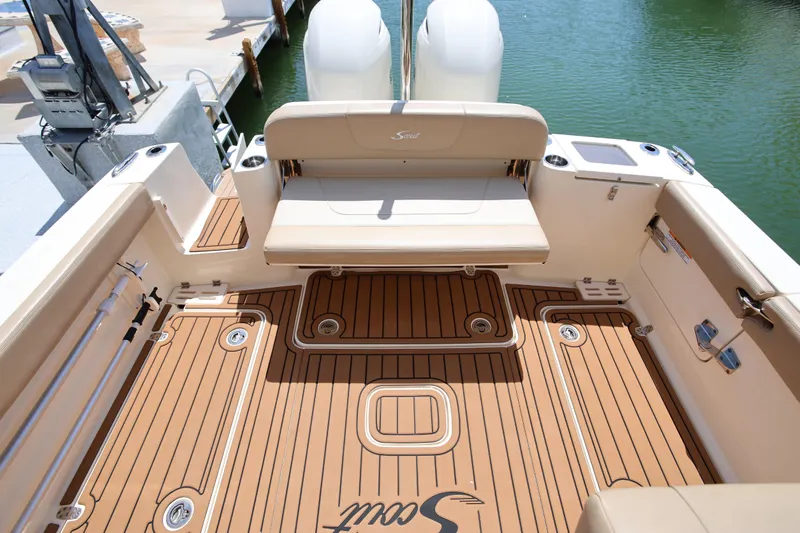  Yacht Photos Pics 2022 Scout 277 Dorado boat interior with teak flooring and seating.
