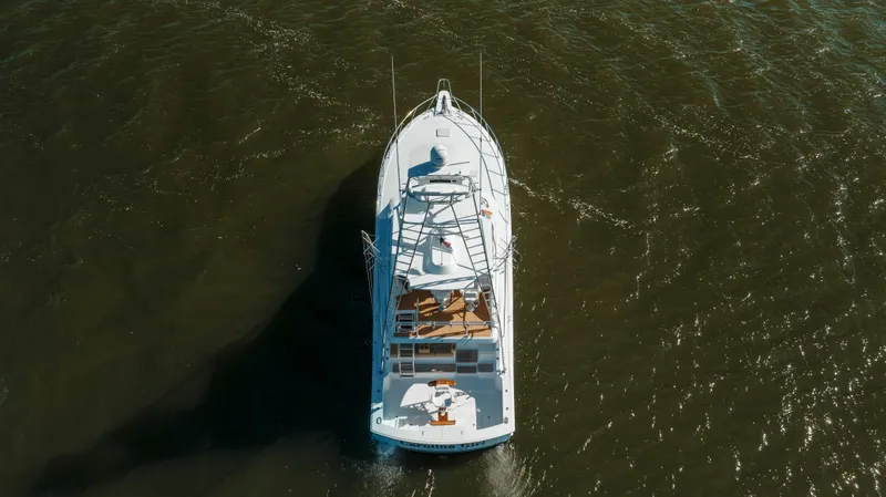 Carolina Girl Yacht Photos Pics Aerial view of 2005 Hatteras 54 Convertible yacht on open water.