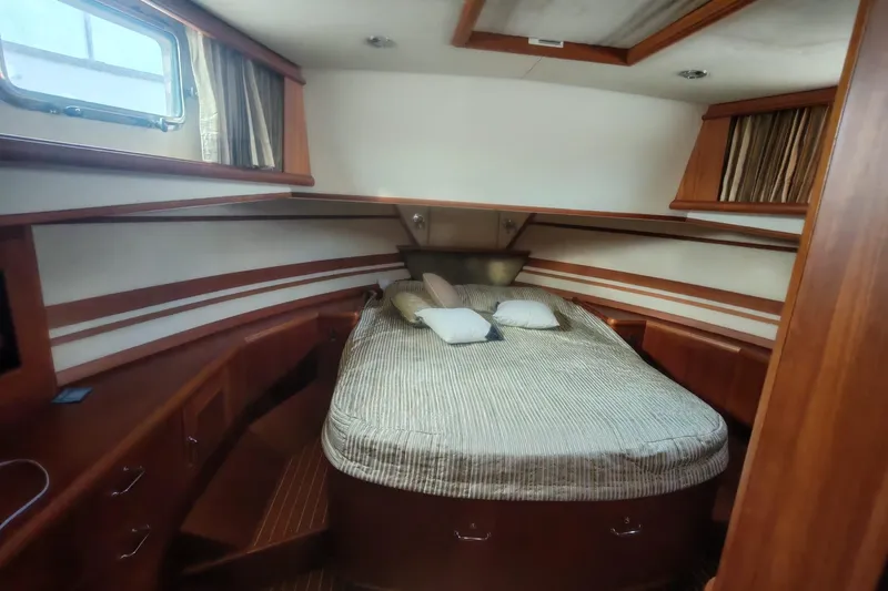 Sesaccia Yacht Photos Pics Luxurious cabin interior of 2007 Grand Banks 47 Europa yacht with cozy bedding.