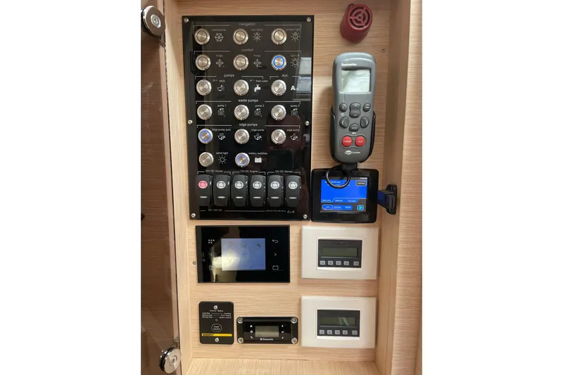  Yacht Photos Pics Control panel of 2017 Jeanneau 64 yacht with navigation and system controls.