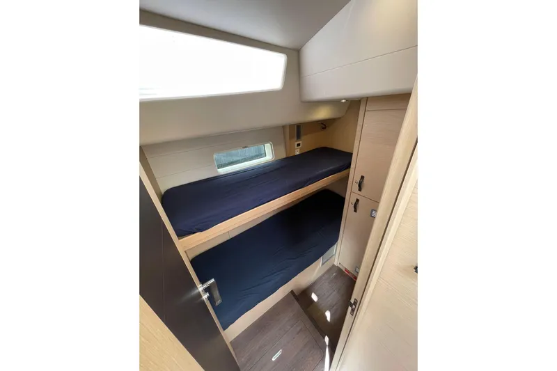  Yacht Photos Pics 2017 Jeanneau 64 yacht cabin with bunk beds and modern interior design.
